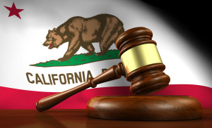 This is a picture of a California flag with a gavel in front of it.