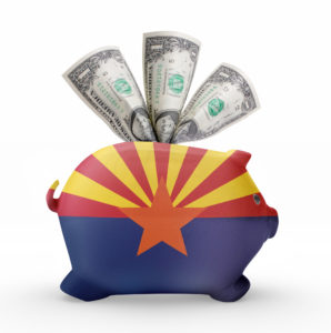 Side view of a piggy bank with the flag design of Arizona