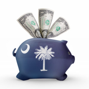 Side view of a piggy bank with the flag design of South Carolina.