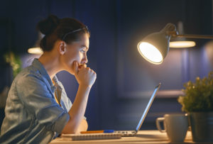 Casual beautiful business woman working on a laptop.