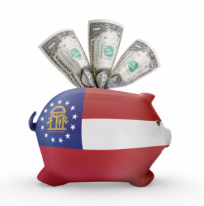 Side view of a piggy bank with the flag design of Georgia.