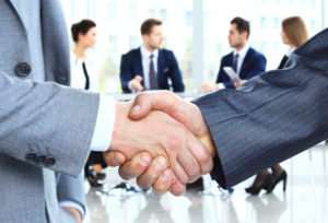Closeup of a business handshake. Business people shaking hands.