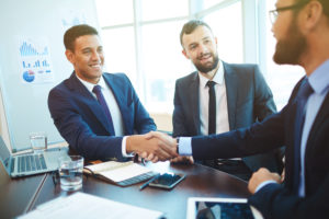 Businessmen shaking hands during a meeting